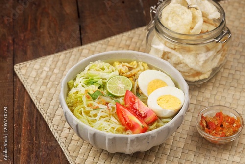 Konstfotografi Soto ayam is a typical Indonesian food in the form of a type of chicken soup with a yellowish sauce