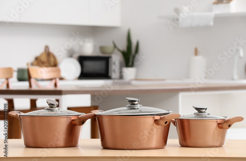 Copper cooking pots on tabl...