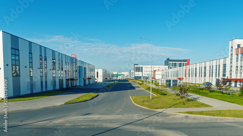 Фотография Modern industrial business park with clean streets and low-rise office buildings