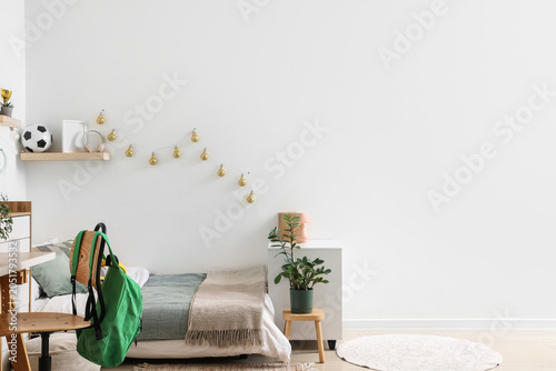 Stylish teenage room with c...