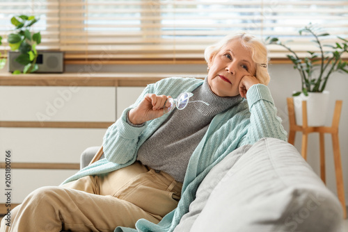Thoughtful senior woman wit...
