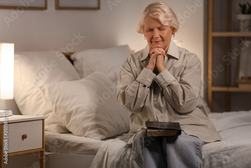 Christian senior woman with...
