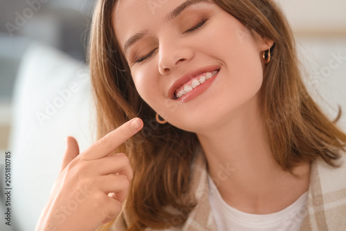 Smiling young woman with de...