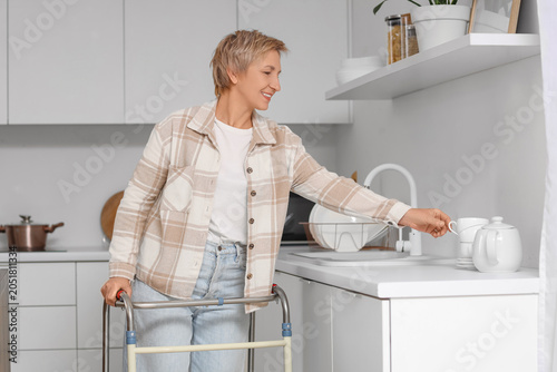 Mature woman with walker ta...