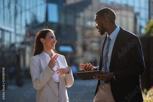 Fotografía Diverse colleagues communicating using sign language outdoors