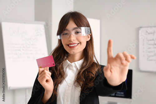 Young businesswoman in AR g...