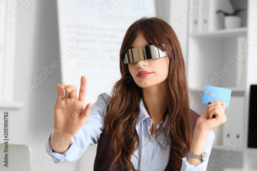 Young businesswoman in AR g...