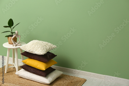 Stack of cushions on carpet...