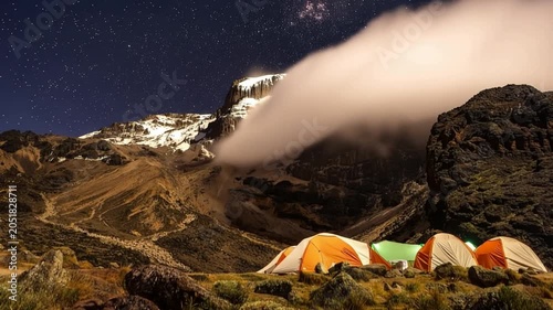 Mount Kilimanjaro. Kilimanjaro National Park in Tanzania, Africa. Trekking and climbing to the summit. Time lapse. Night video in starry sky. Tent