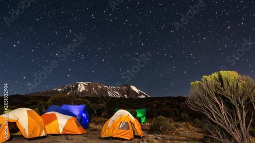 Mount Kilimanjaro. Kilimanjaro National Park in Tanzania, Africa. Trekking and climbing to the summit. Time lapse. Night video in starry sky.