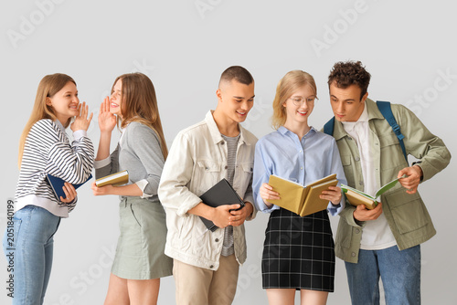 Group of students with book...