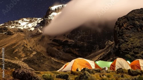 Mount Kilimanjaro. Kilimanjaro National Park in Tanzania, Africa. Trekking and climbing to the summit. Time lapse. Night video in starry sky. Tent