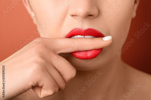Woman with red lips on colo...