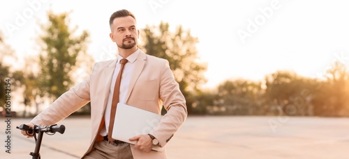 Modern businessman with lap...