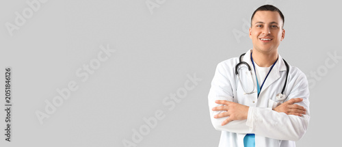 Handsome doctor on light ba...