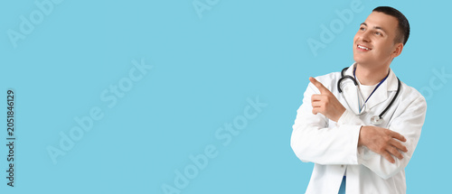 Handsome doctor pointing at...