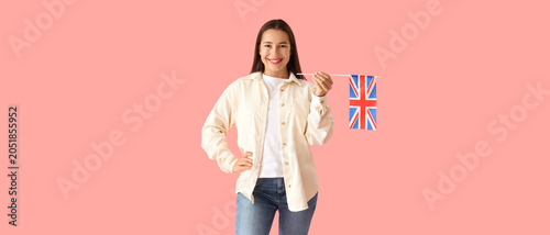 Obraz na płótnie Young woman with UK flag on pink background