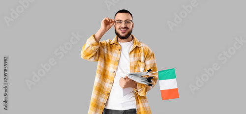 Young man with papers and f...