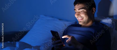 Young man using mobile phon...