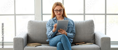 Mature woman using tablet c...