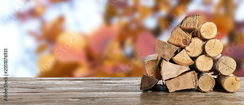 Stack of firewood on wooden...