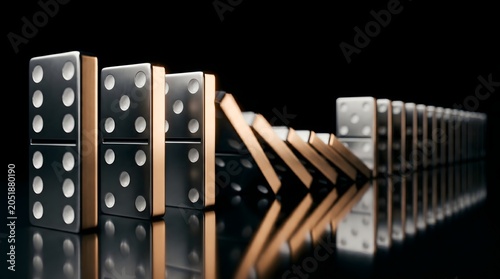 Metallic silver and gold domino tiles tumbling in a sequential chain reaction, a powerful metaphor for systemic risk, cause and effect, and the momentum of business decisions.