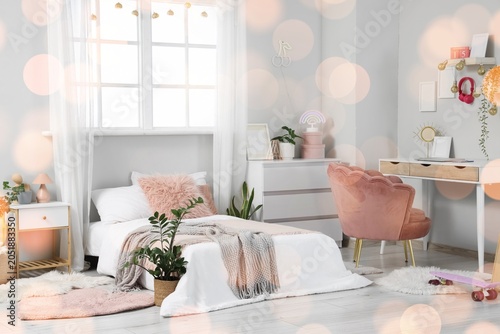 Cozy teen girl's bedroom in...