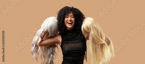 Happy young woman holding t...