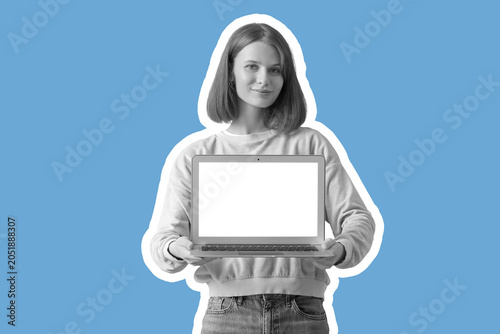 Young woman with blank lapt...