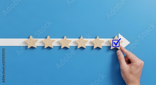 Hand placing a blue checkmark on a wooden star on a white arrow