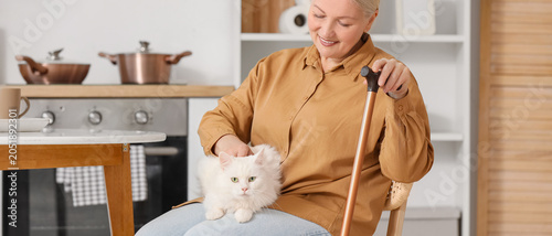 Mature woman with cane and ...
