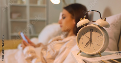 Alarm clock on table of you...