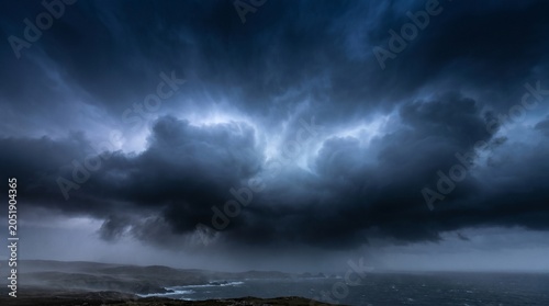 Konstfotografi Storm cloud gradient forming over a dark restless ocean coast during a severe ga