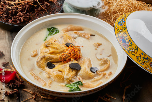 Fotografie Fish maw, kudzu root, and stewed free-range chicken soup in a round porcelain bo