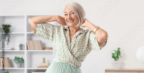Beautiful mature woman danc...