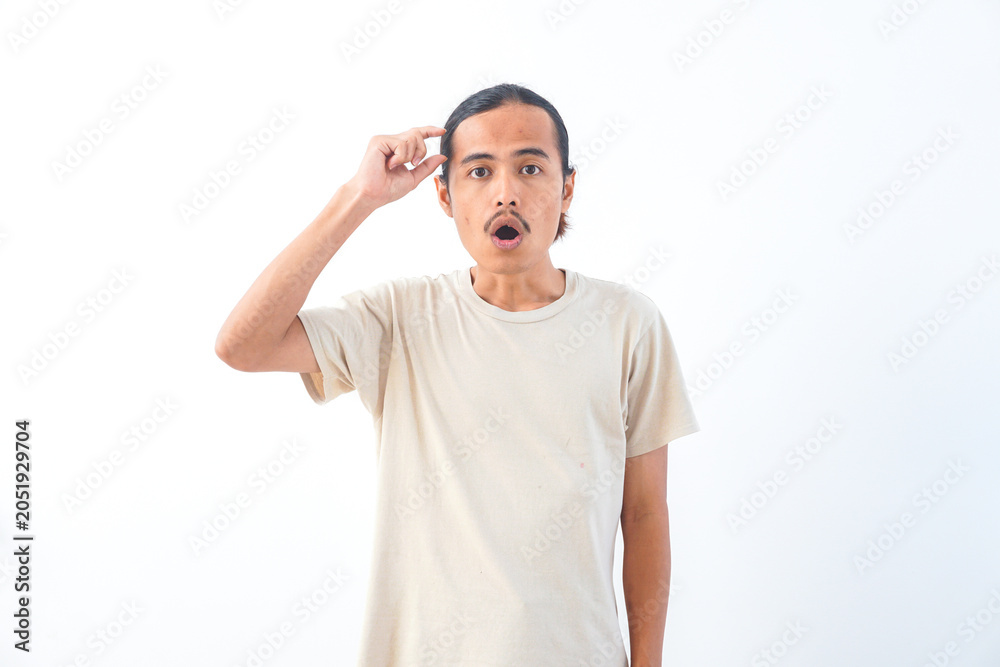 Fototapeta premium Young Asian man in a shirt, with a shocked face expression. Isolated on a white background