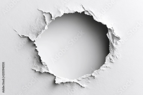 A torn hole in white textured paper revealing a soft gradient background with subtle shadow.
