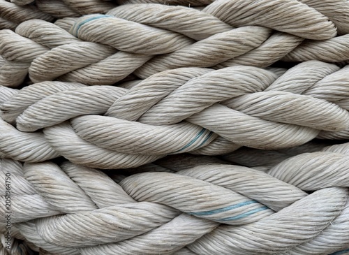 Bild auf Leinwand Close-up view of thick braided synthetic marine mooring ropes arranged in an interwoven pattern