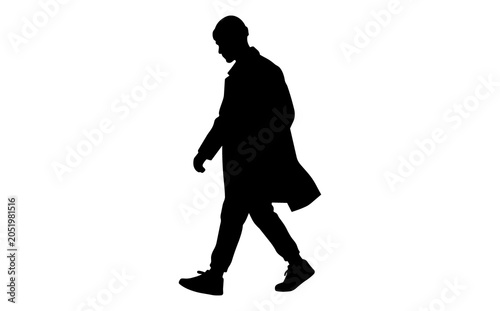 Silhouette of a young man walking with a coat draped over his arm on a white background emphasizing fashion movement and urban style in a minimalistic scene