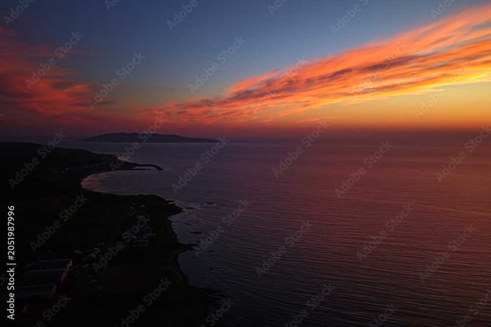 Fototapeta premium Aerial drone photo of Teuri Island at sunset from Yagishiri Island, Hokkaido, Japan