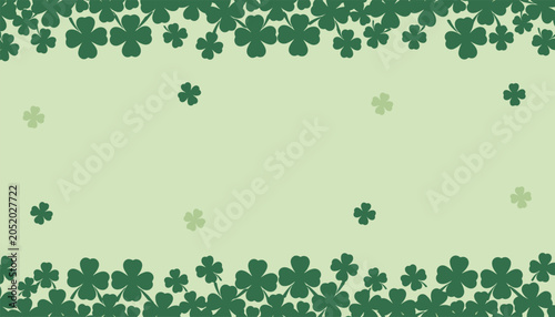 Decorative border of green four leaf clovers and shamrocks for saint patrick day holiday celebration background.
