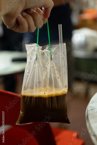 Traditional Kopi Served in Plastic Bag with Straw, Singapore