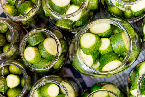 Canvastavla Homemade pickled cucumbers in glass jars on the kitchen counter