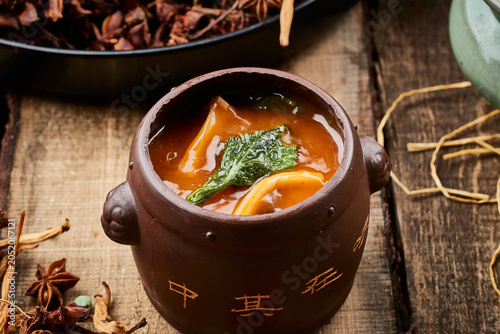 Foto Fish maw on an old wooden board, a dish of Buddha Jumps Over the Wall