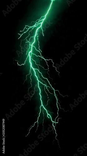 Vibrant green lightning bolt discharge flashing across a dark black background symbolizing electric power and atmospheric energy during a storm