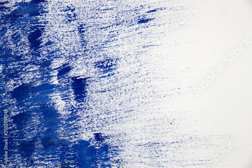 Abstract blue brushed paint texture on white background