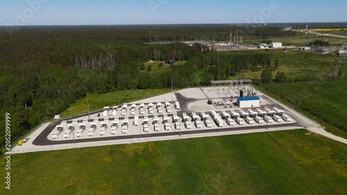 Photography Aerial view showing a large industrial battery energy storage system and adjacen