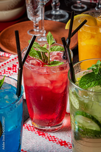 Refreshing drink selection featuring vibrant beverages at a lively gathering on a festive table
