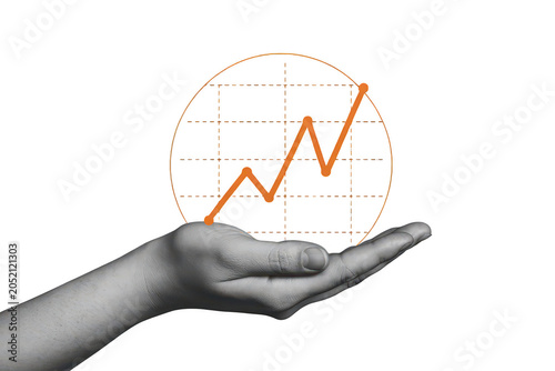 A human hand holding a glowing orange financial growth chart graph on a solid black background, for business and, investment concepts