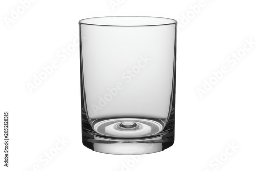A clear empty glass tumbler with a thick base and smooth sides isolated on a black background, for drinkware and, beverage needs